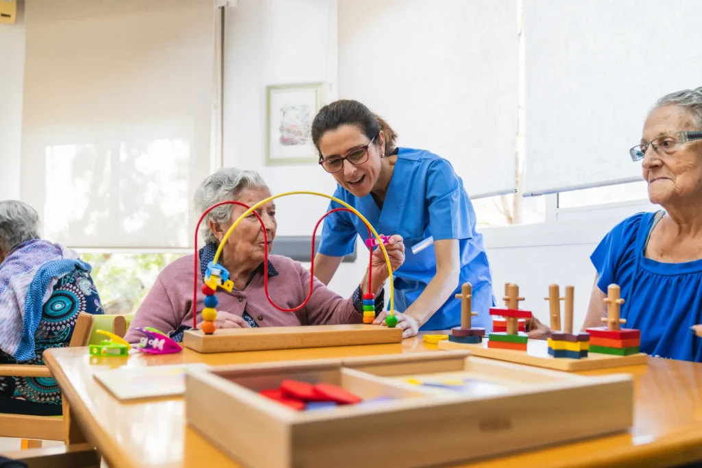Caring in-home dementia care nurse assisting elderly woman with cognitive games in Carroll County, Maryland