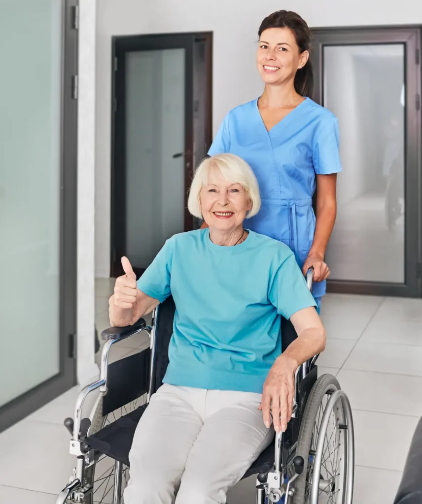 Friendly geriatric nurse assisting a senior woman with a smile in Frederick County, Maryland, providing in-home care support.