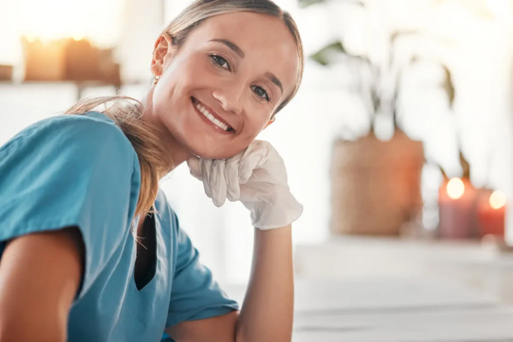 A caregiver providing gentle personal care assistance to a woman in her home in Montgomery County, Maryland.