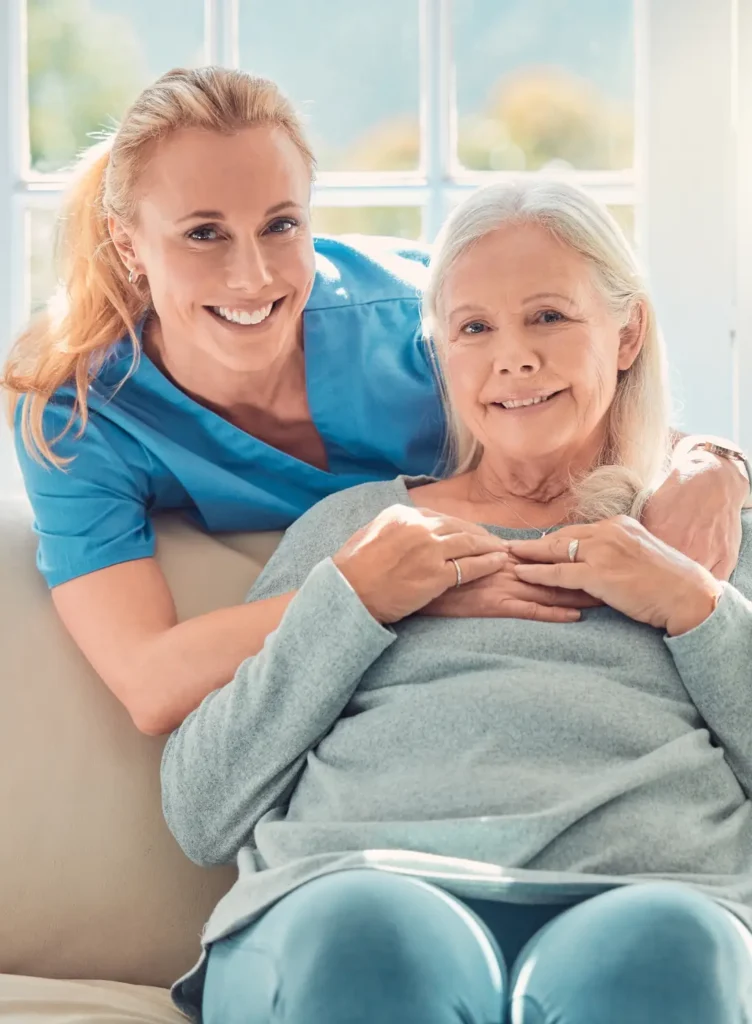 A happy in-home caregiver smiling while providing care in Montgomery County, Maryland.