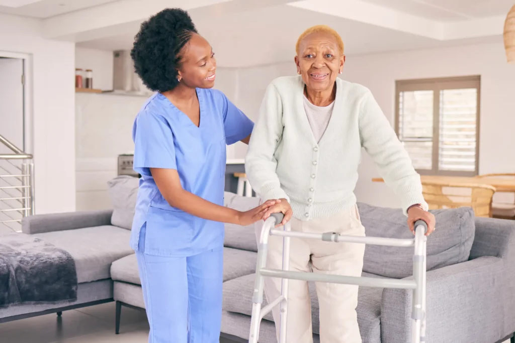 Caring in-home support assisting elderly woman with walking frame in Frederick County, Maryland