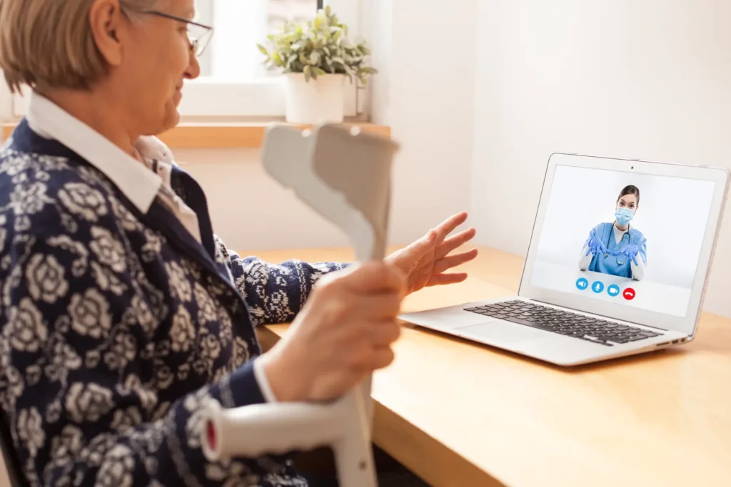 An in-home caregiver consults with a senior woman in her home in Washington County, Maryland.